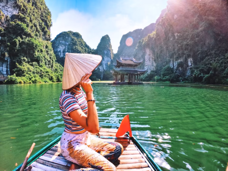 D7 8 NINH BINH On the Bow of the Boat Person Looks Out.jpeg